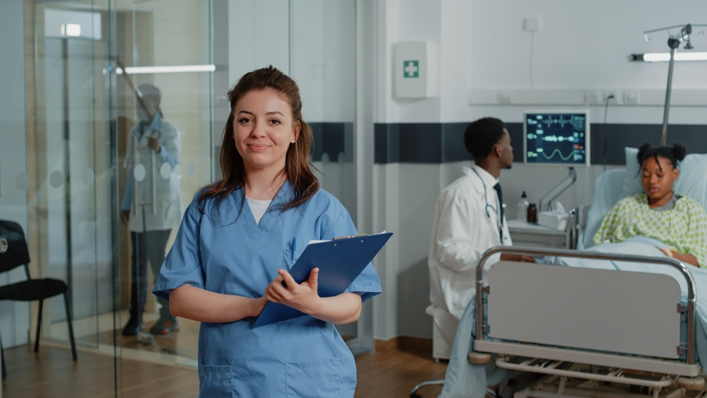 Portrait,Of,Woman,Working,As,Nurse,Holding,Checkup,Papers,While